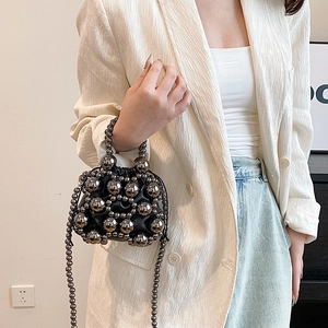 Modern black pearl mini shoulder bag with decorative silver beads and long beaded strap