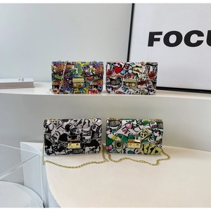 Graffiti printed small square bags with gold chains in four colors displayed together