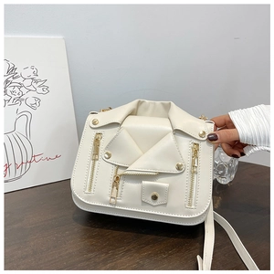 Close-up of white motorcycle jacket shaped crossbody bag with golden zippers