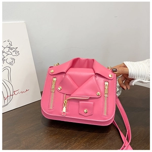 Detailed view of pink leather biker jacket bag with gold zippers and studs