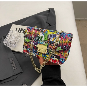 Detail of colorful graffiti print mini square bag with gold chain and metal lock