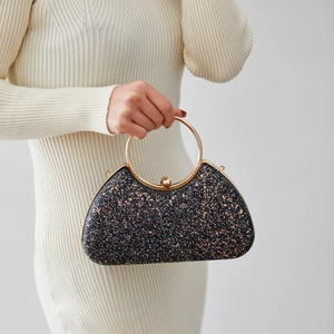 Elegant black glitter evening clutch with gold circular handle for festive occasions