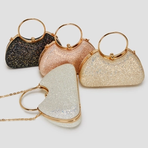 Glitter evening clutch bags in black, rose gold, and silver with metal top handles