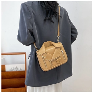 Beige faux leather crossbody bag in biker jacket design shown on model for size and fit