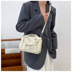Chic beige biker jacket styled PU shoulder bag on model with gold zipper details