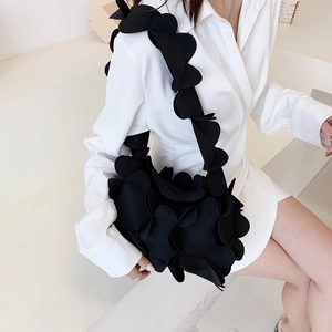Chic black 3D petal shoulder bag for women made of soft textured floral fabric