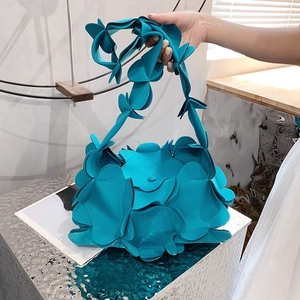Bright blue petal-shaped crossbody bag with unique 3D floral layers for women