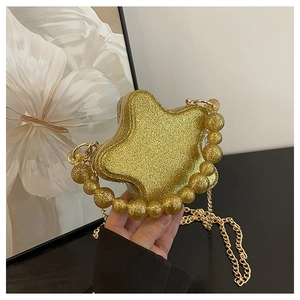 Detailed view of the sparkling gold star-shaped bag with chunky glitter and pearl handle