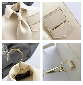 Detailed close-up of cream PU tote featuring shirt collar design and gold hardware accents