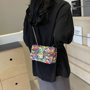 Graffiti print crossbody chain bag for women with street art pattern and gold clasp