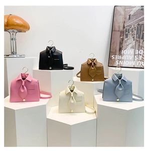 Detailed view of creative shirt-shaped PU leather crossbody bags with metal buckles