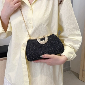 Black glitter evening clutch bag with gold rhinestone clasp and metal chain strap