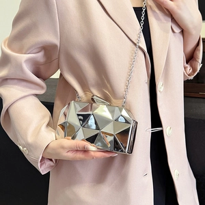 Silver geometric crossbody bag with 3D metallic texture and elegant chain strap