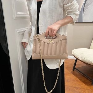 Beige quilted tote bag with vertical pleats and golden chain strap for women