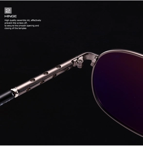 Macro detail of high-quality metal hinge on classic aviator polarized sunglasses