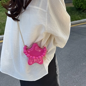 Star shaped rose pink crossbody bag with large bead handle and gold chain strap