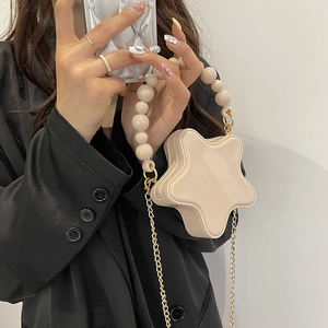 Chic beige star-shaped crossbody bag with faux pearl handle and gold chain strap