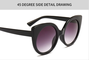 Detail view of large cat-eye sunglasses with purple gradient lenses and black frames