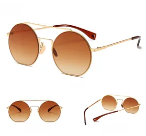 Detailansicht der runden Metall-Sonnenbrille mit Teeglas-Verlauf und goldenem Gestell