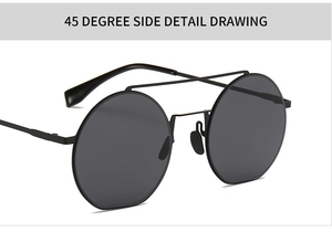 Detailansicht im 45-Grad-Winkel: schmale runde schwarze Sonnenbrille mit Doppelsteg