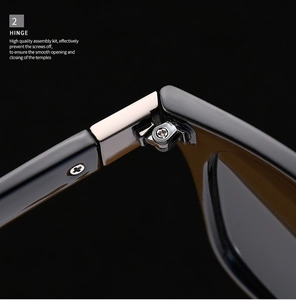 Detailed macro view of the premium silver metal hinge on classic black aviator sunglasses