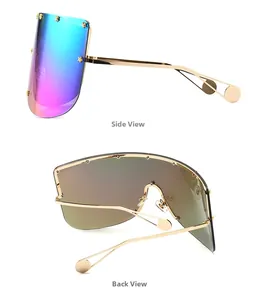 Detail view of oversized mask sunglasses showing side profile and gold star rivets