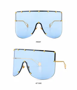 Front and 45-degree side view of blue mask sunglasses with gold star rivet accents
