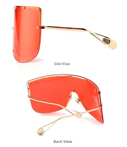 Side and back view of oversized red shield sunglasses with gold star rivets and metal frames