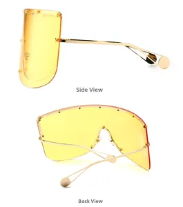 Side and back view of oversized shield sunglasses with gold star rivets and yellow lens