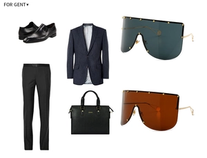 Flat lay of oversized shield sunglasses with gold star studs and formal business attire