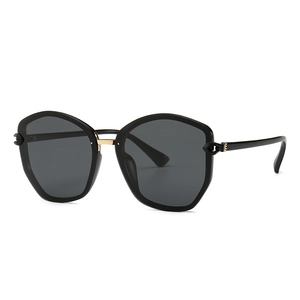 Classic black TR oversized geometric sunglasses with golden metal hinges and gray lenses