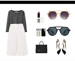 Flat lay of steampunk round sunglasses with elegant striped outfit and fashion accessories