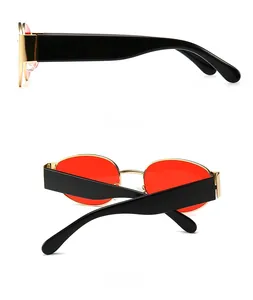 Steampunk Oval-Sonnenbrille mit roten Gläsern und Goldrahmen in Seiten- und Rückansicht