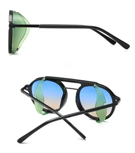 Steampunk sunglasses with black frames, blue-orange gradient lenses and green side shields