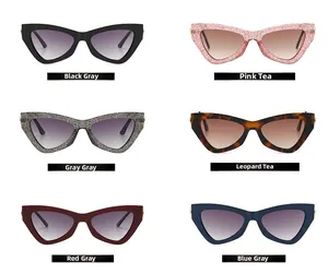 Flat lay of trendy narrow cat-eye sunglasses in diverse colors and glitter finishes