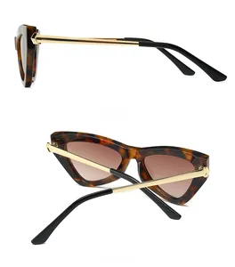 Side and back view of retro cat-eye sunglasses with tortoise frame and gold metal temples