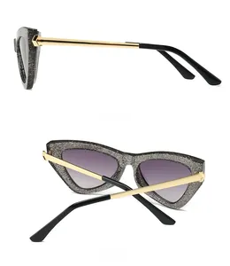 Side and back view of retro cat-eye sunglasses with glitter frame and gradient lenses