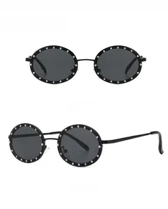 Front and side view of black round sunglasses with decorative silver rhinestones