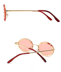 Side and back view of round red sunglasses with sparkling rhinestone embellishments