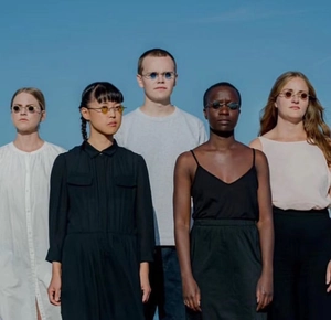 Outdoor group shot of models wearing retro steampunk small round metal sunglasses