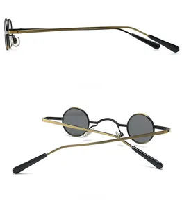 Side and back view of retro steampunk sunglasses with round metal frames and grey lenses