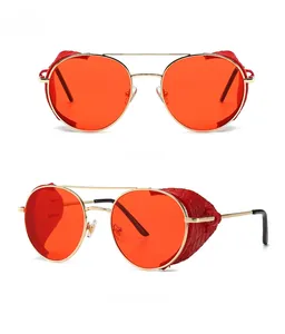 Steampunk round sunglasses with gold metal frame, red lenses and snakeskin leather side shields