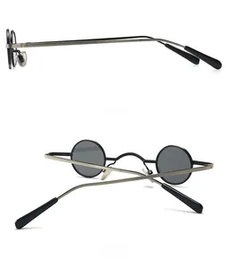 Detail of round steampunk sunglasses with side and back views of metallic brushed arms