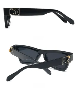 Detail view of vintage cat-eye sunglasses with luxury gold metal hinges and rivets