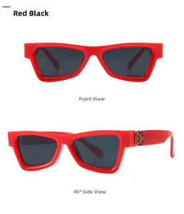 Close-up of retro cat-eye red frames with dark lenses and gold hinge detail