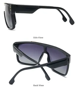 Detail view of oversized black frame sunglasses with purple gradient lenses and side metal dots