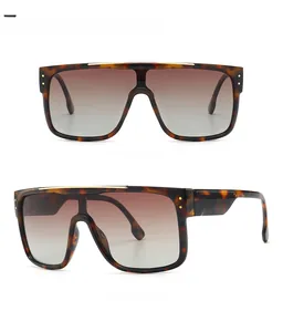 Detailed front and side view of oversized tortoise shell sunglasses with a flat top design