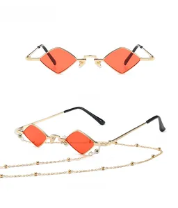 Front and side view of gold metal vintage rhombus sunglasses with red lenses and chain