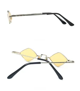 Detail view of silver metal retro sunglasses with diamond yellow lenses from side and back