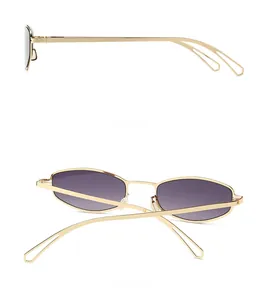 Vue détaillée des profils latéraux et arrière des lunettes de soleil en métal doré et verres dégradés